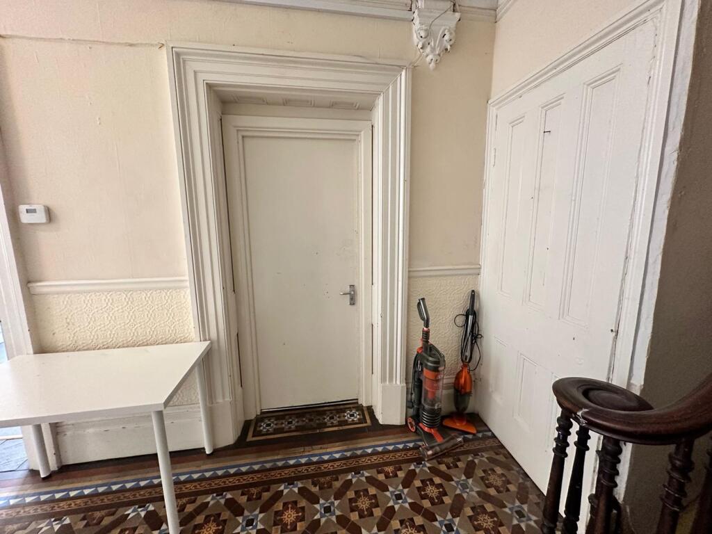 A well-maintained hallway featuring decorative ...
