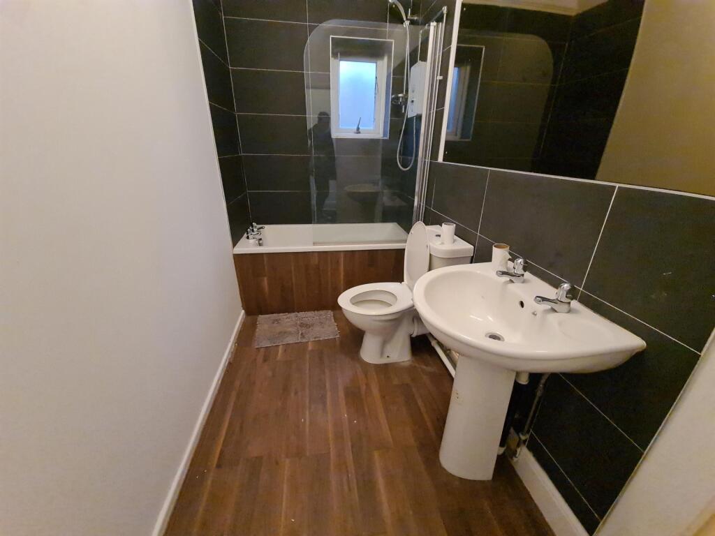 A clean and well-maintained bathroom featuring ...