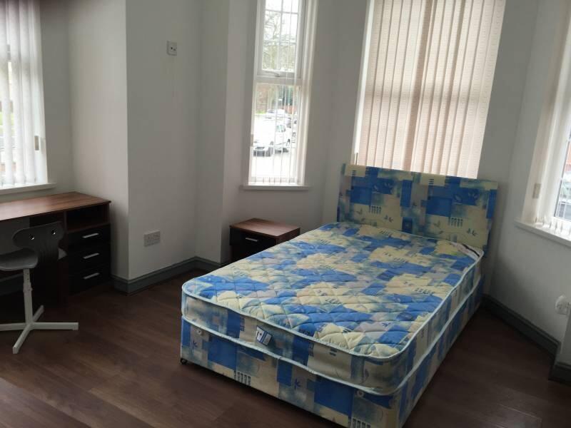 Bright, double bedroom with a patterned double ...