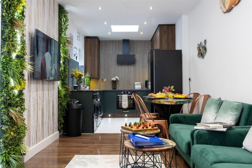 A modern and inviting open-plan living room and...