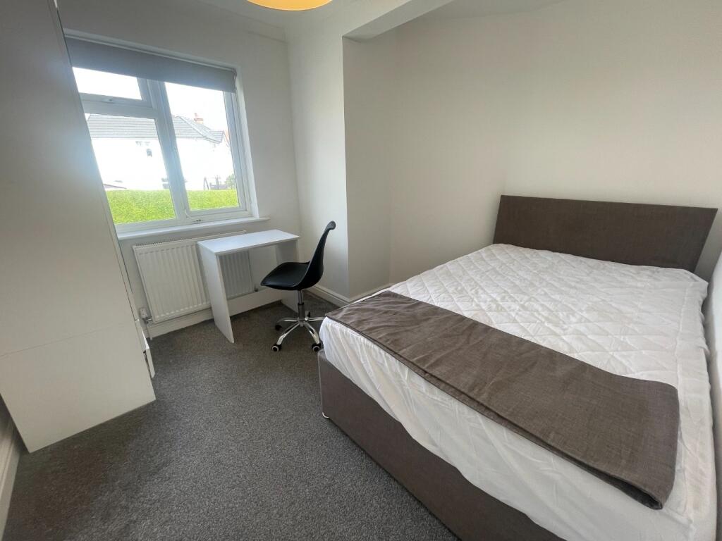 Bright and inviting double bedroom featuring a ...