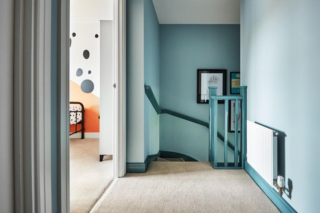 A light and bright landing welcomes you upstairs