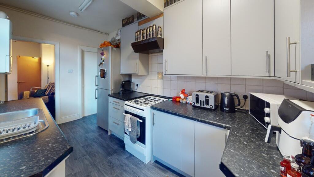 A clean and modern kitchenette, perfect for stu...
