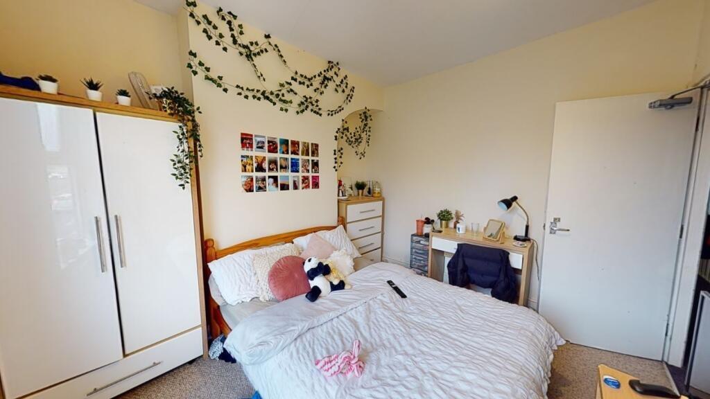 A cozy and inviting master bedroom featuring a ...