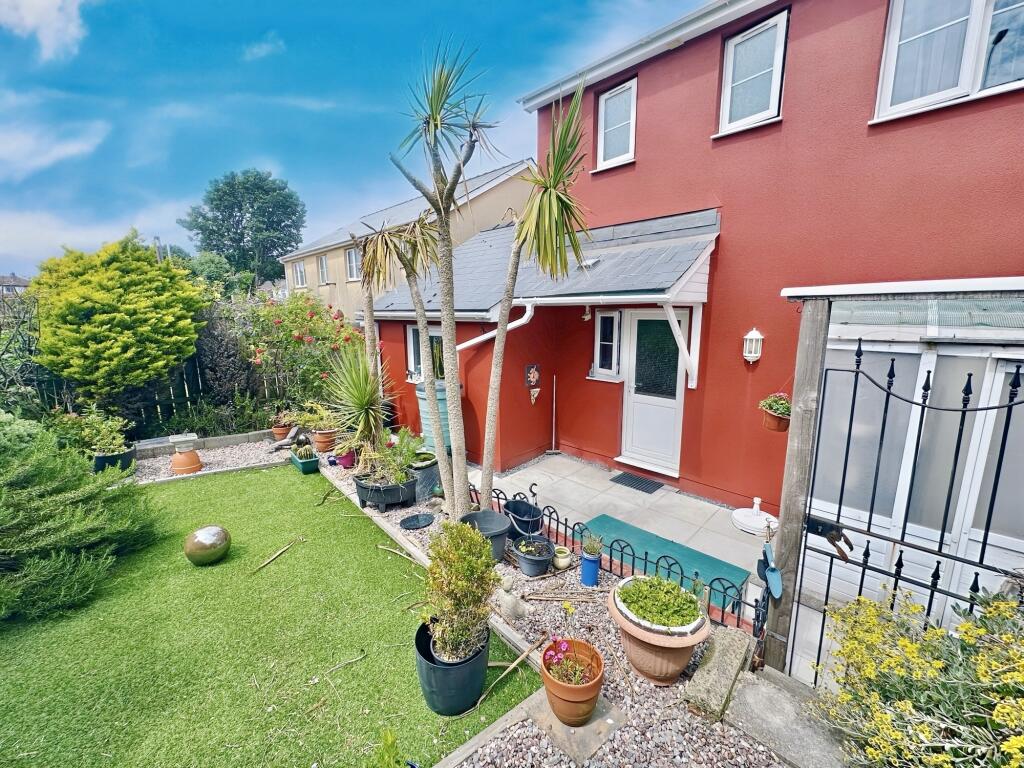 Rear garden with access to garage