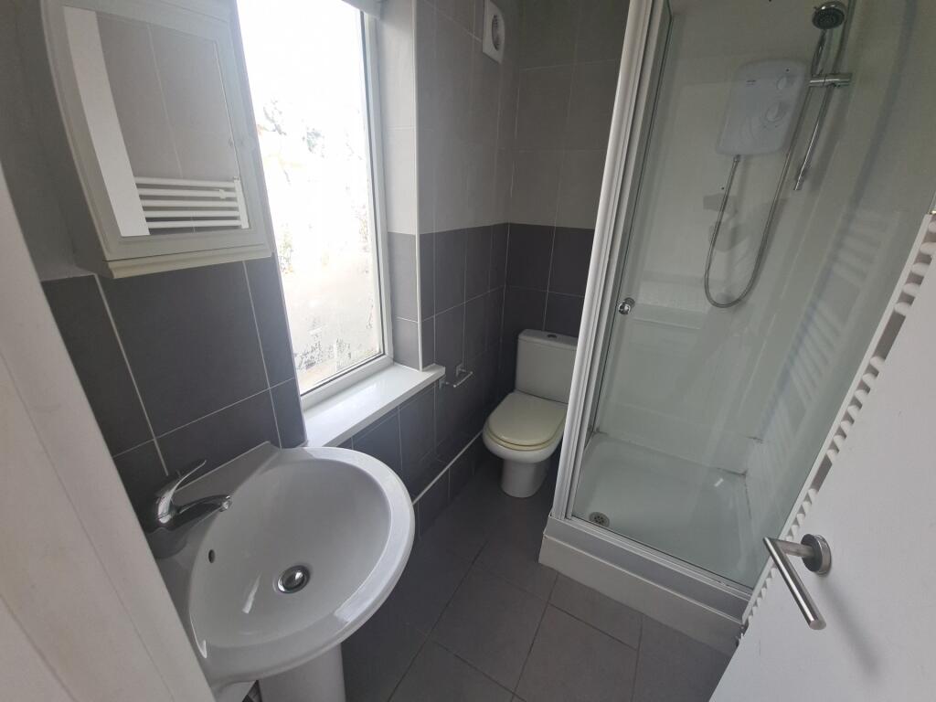 A neat and well-maintained bathroom featuring a...
