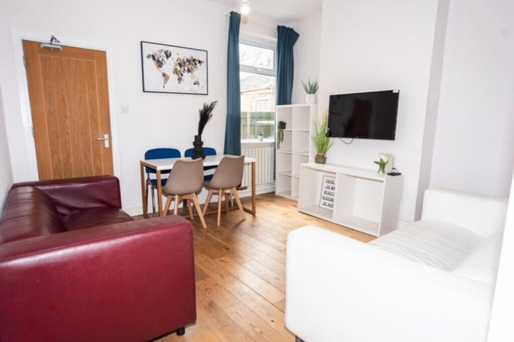 Bright and inviting living room featuring comfo...