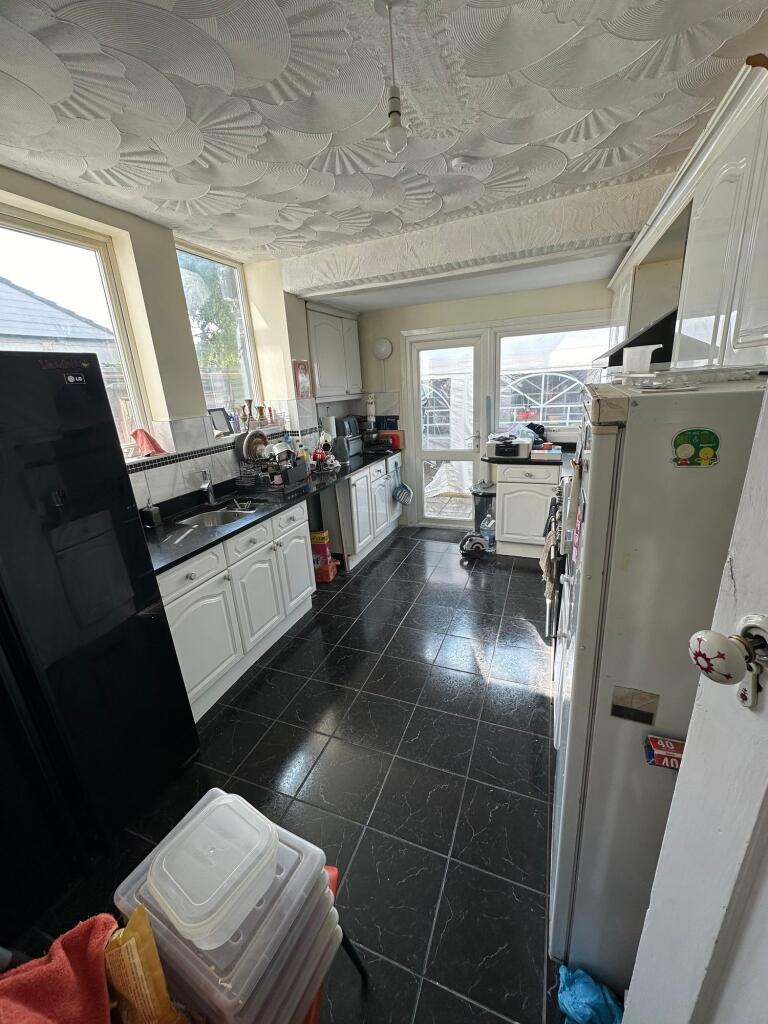 Bright kitchen with ample natural light from la...