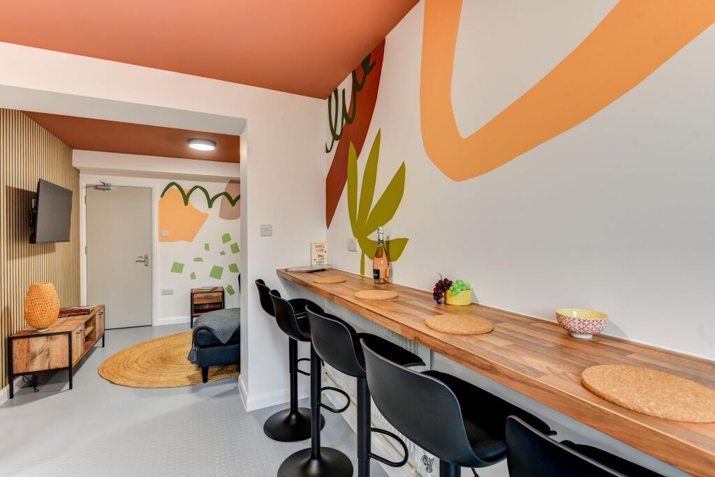 A vibrant communal workspace featuring a stylis...