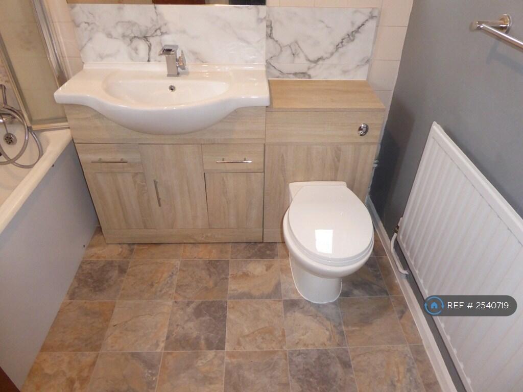 Main Bathroom With Bath And Shower.