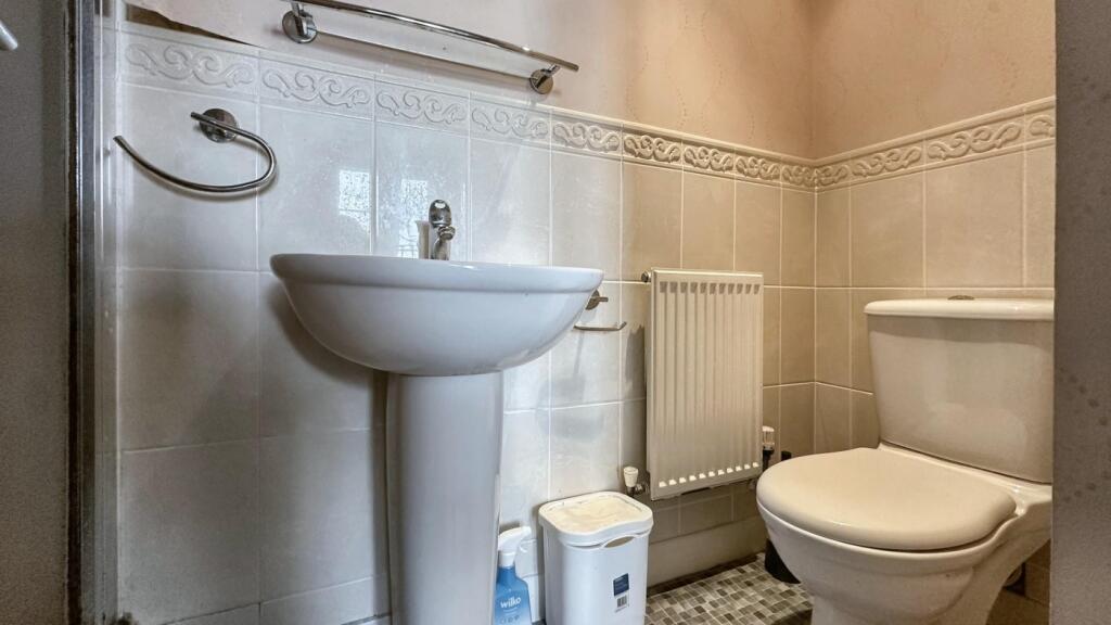 A clean and well-maintained bathroom featuring ...