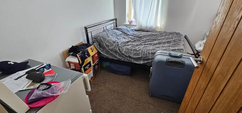 A cozy double bedroom featuring ample natural l...