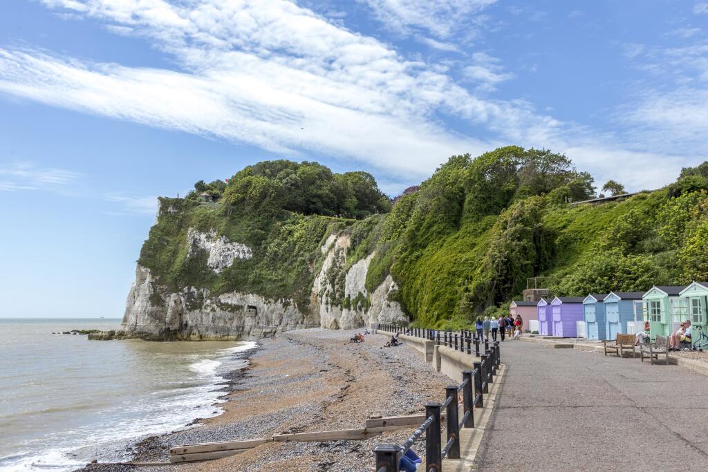 view of the white cliffs at Dover with beach huts