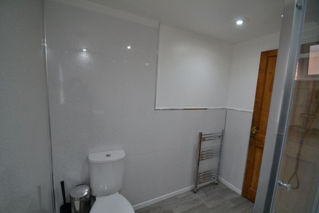 A clean and modern bathroom suite featuring a w...