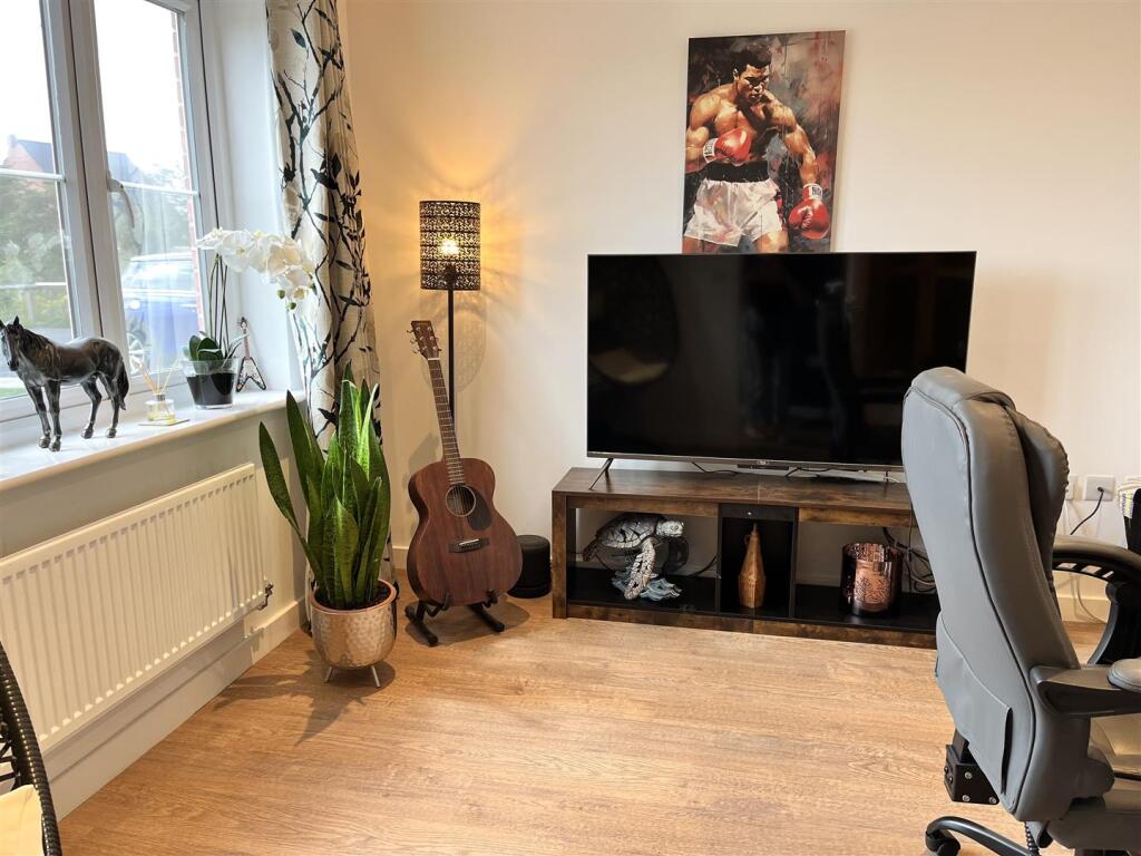 HOME OFFICE/PLAYROOM (FRONT)