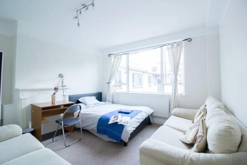 Bright and inviting single bedroom featuring a ...