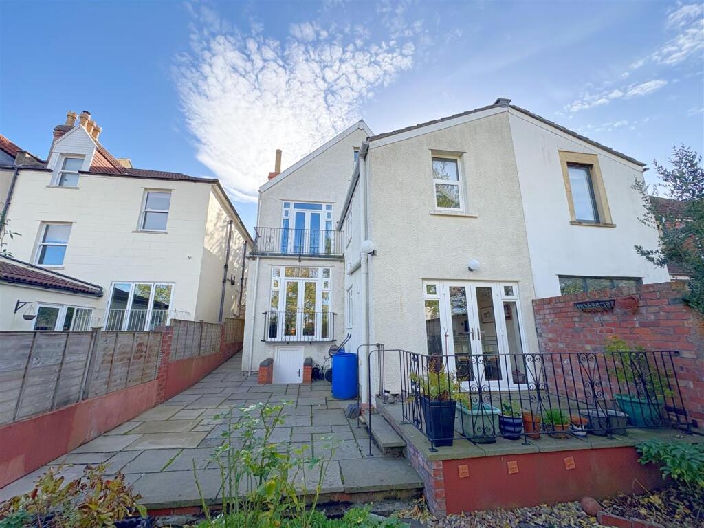 Rear view of property and patio (1).jpg