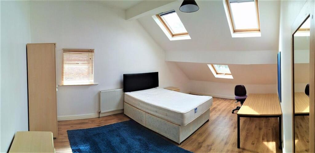Bright and airy single bedroom featuring natura...