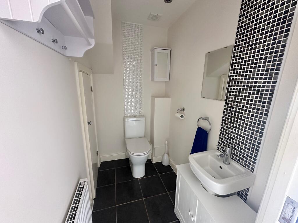 11. Downstairs w.c. &amp; cupboard