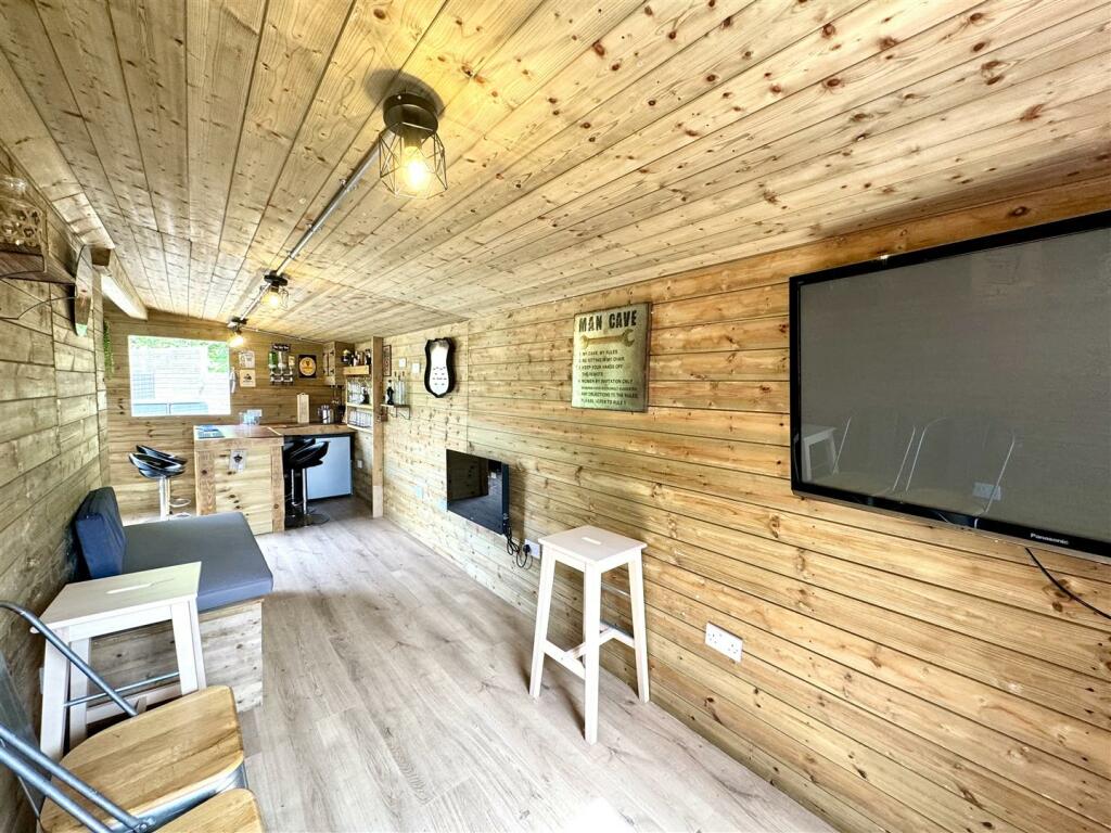 OUTSIDE HOME OFFICE/BAR/HOBBY ROOM