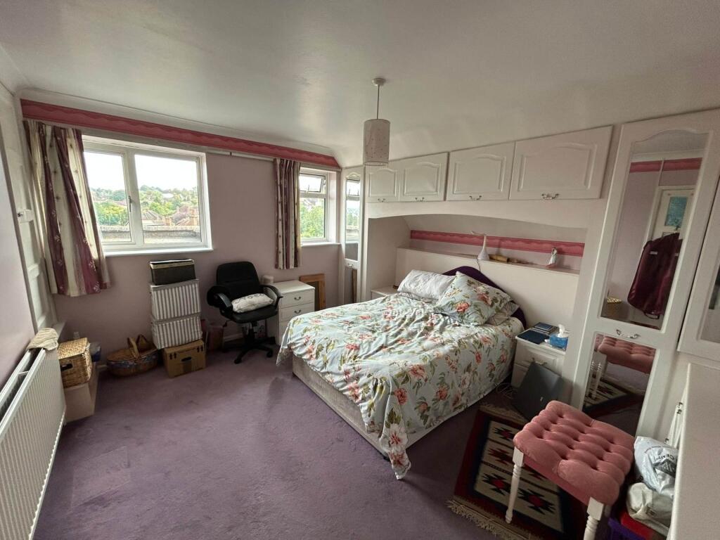 Bright double bedroom with built-in overhead st...