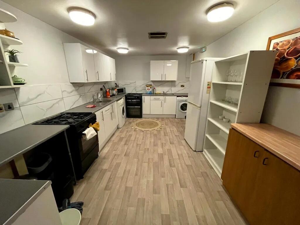 A spacious, well-organized kitchen featuring mo...