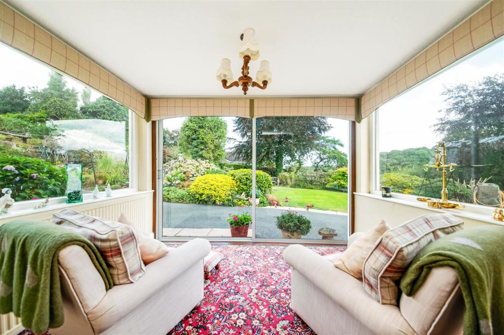 DINING ROOM WITH SUN ROOM ADJOINING