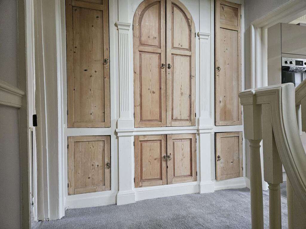 Storage in hallway next to kitchen 