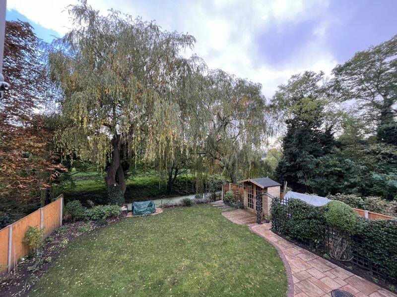 Overhead view of rear garden and rive...