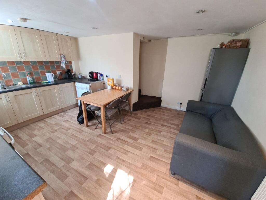 A bright and welcoming living room featuring a ...