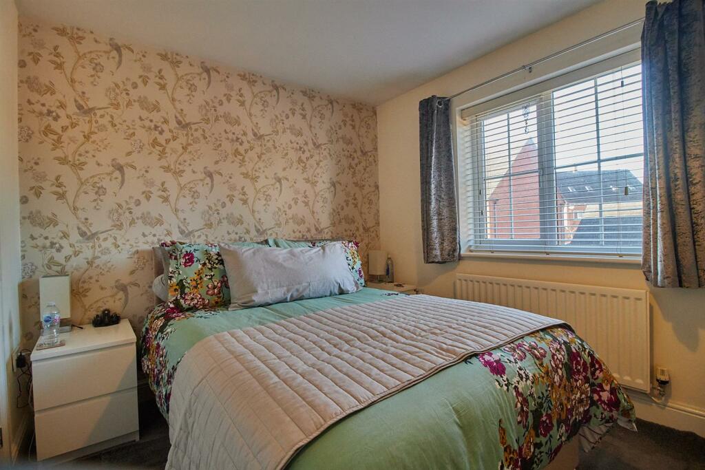 BEDROOM ONE TO FRONT