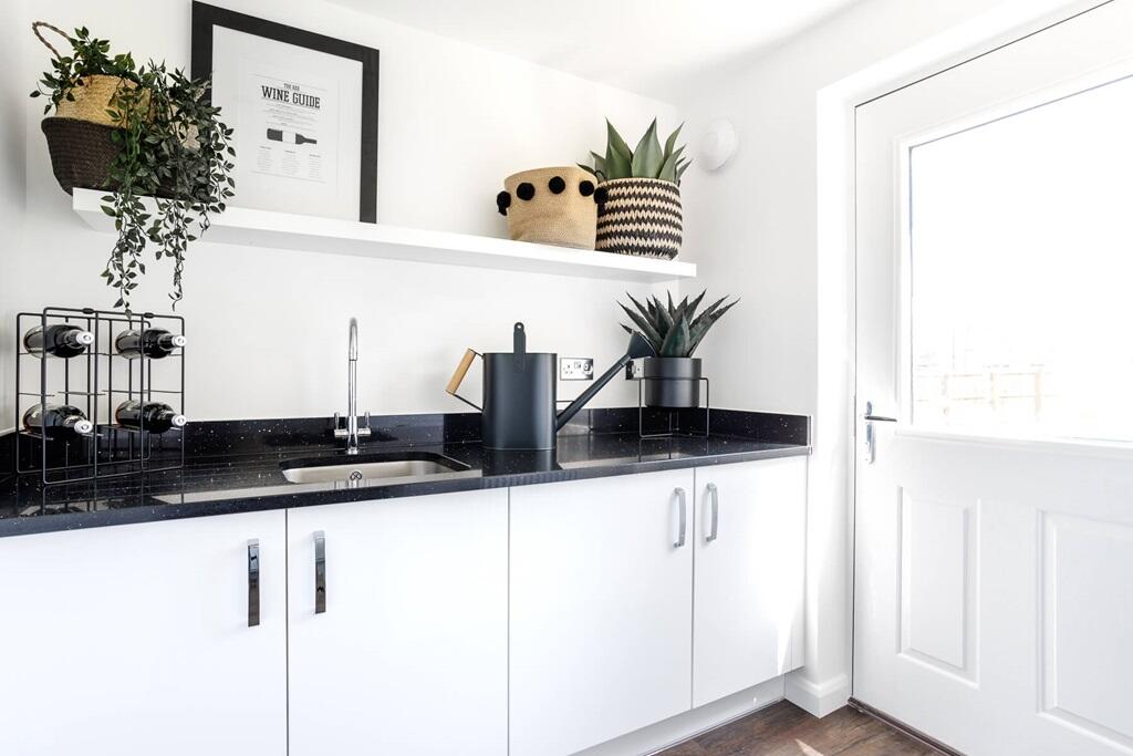 The utility room offers extra storage space