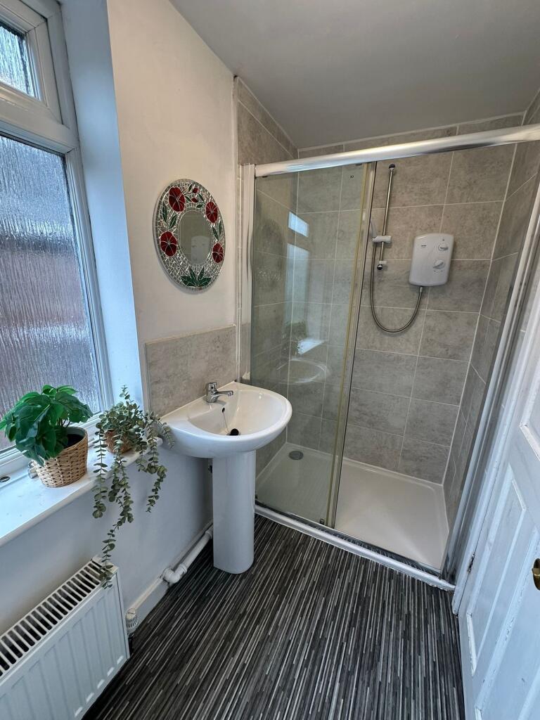 Bright and clean bathroom with a shower cubicle...