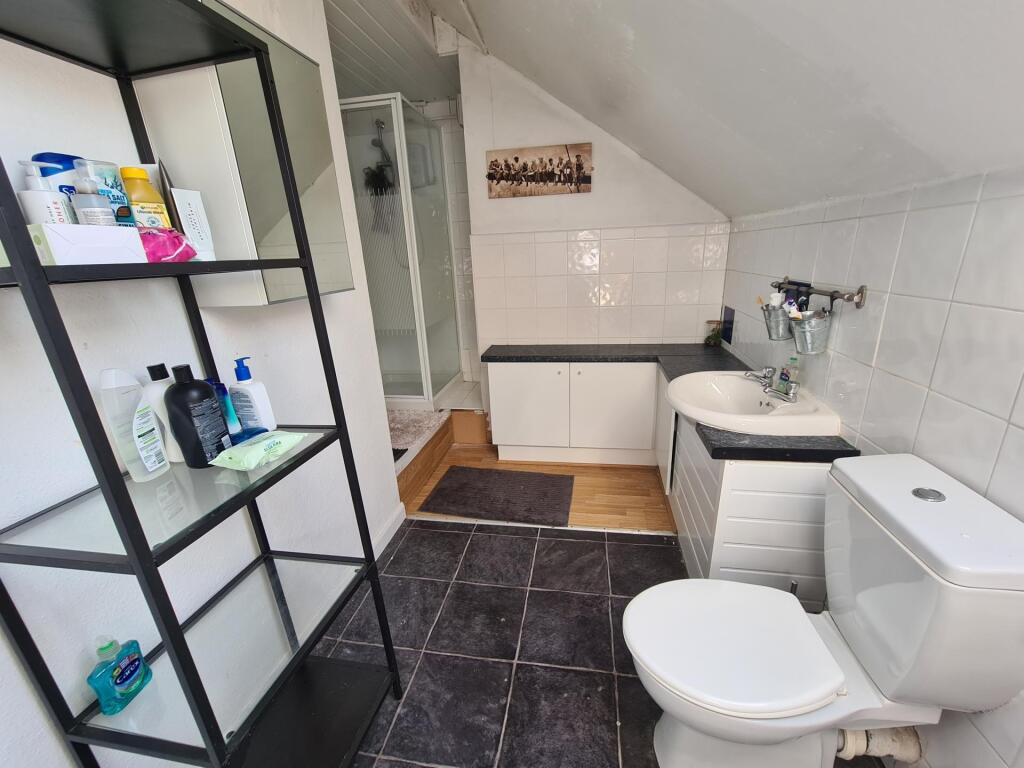 A bright and clean bathroom featuring modern fi...