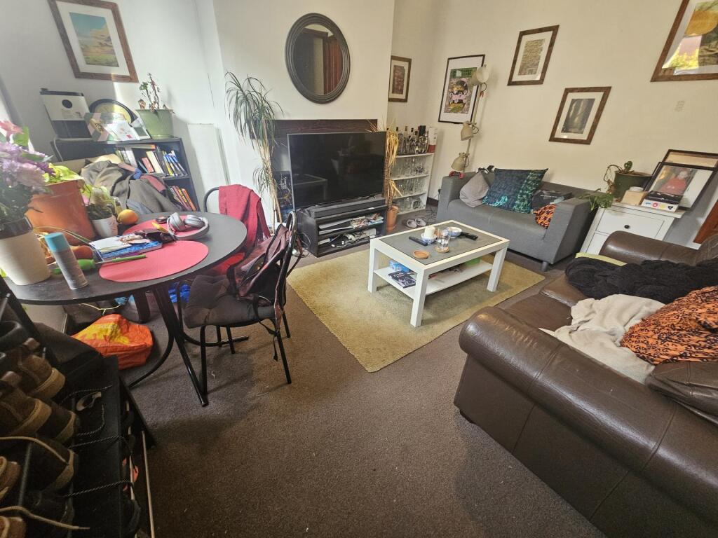 A cozy and inviting living room featuring comfo...