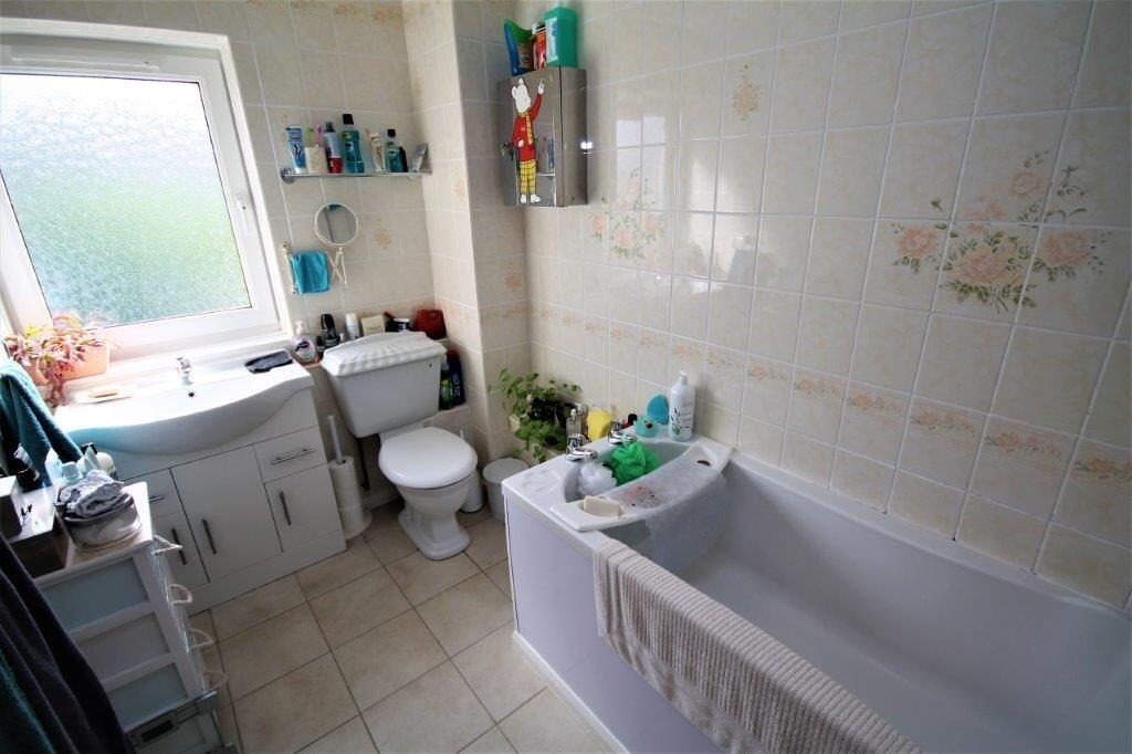 A clean and well-maintained bathroom featuring ...
