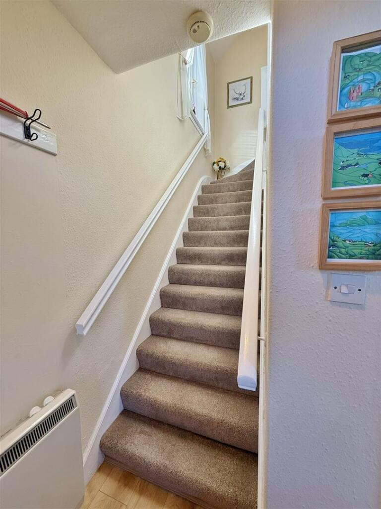 To upper floor