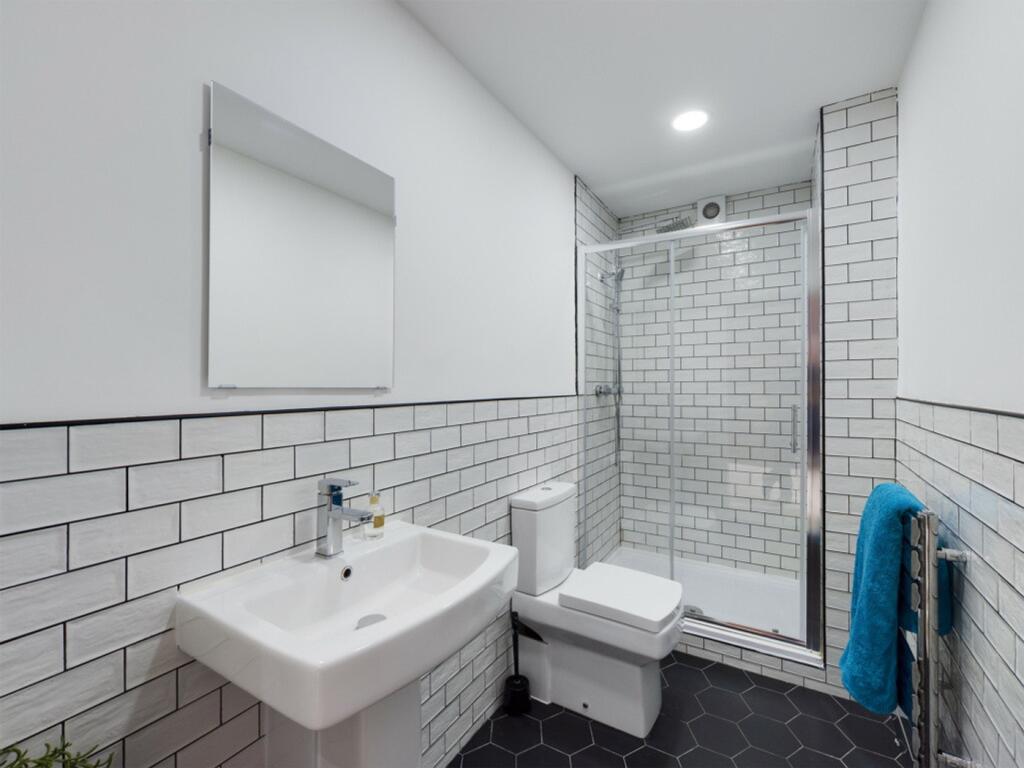 A modern and clean bathroom featuring stylish t...