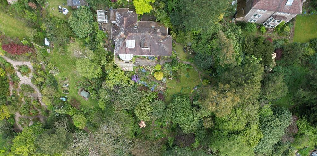 Drone shot of land and house