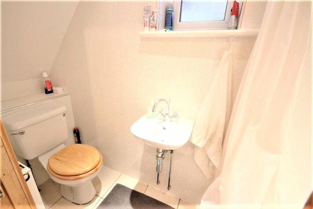 A bright and well-maintained bathroom featuring...