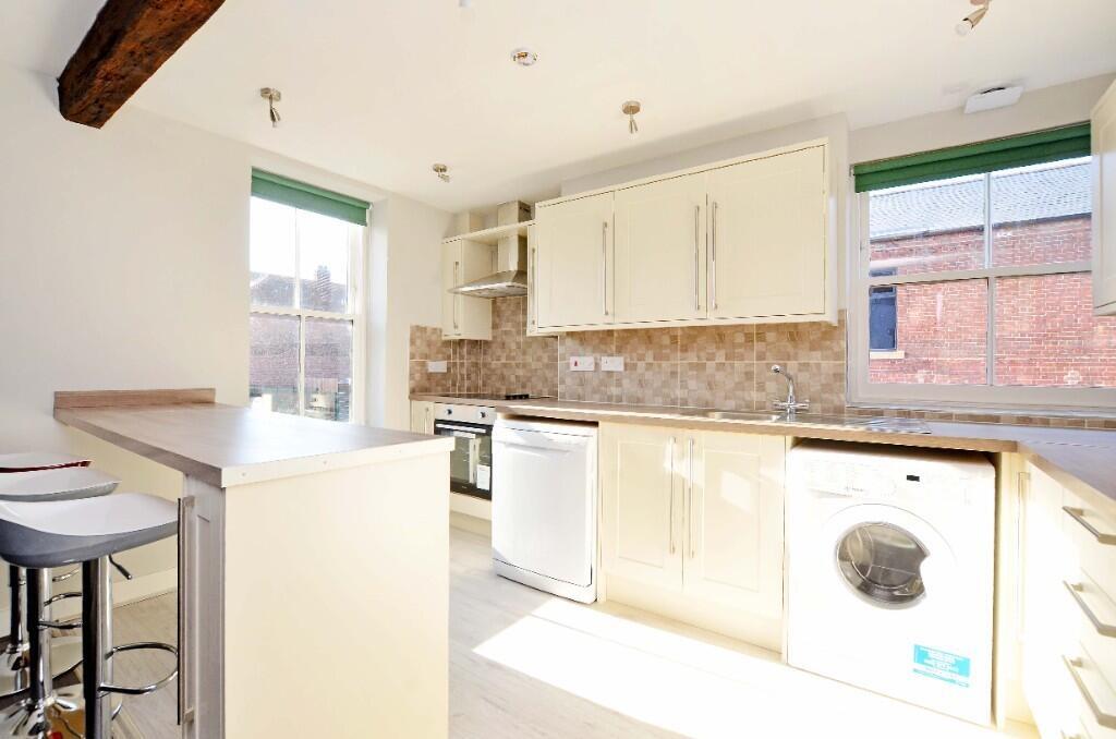 Bright contemporary kitchen with ample natural ...
