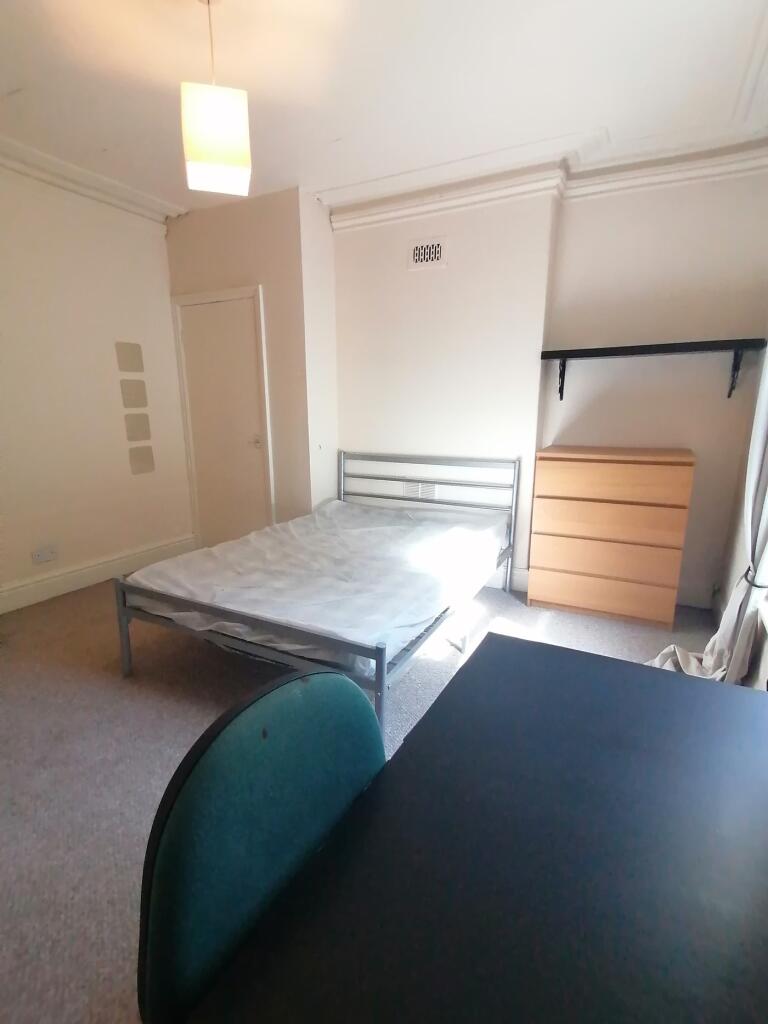 A spacious and bright double bedroom with ample...