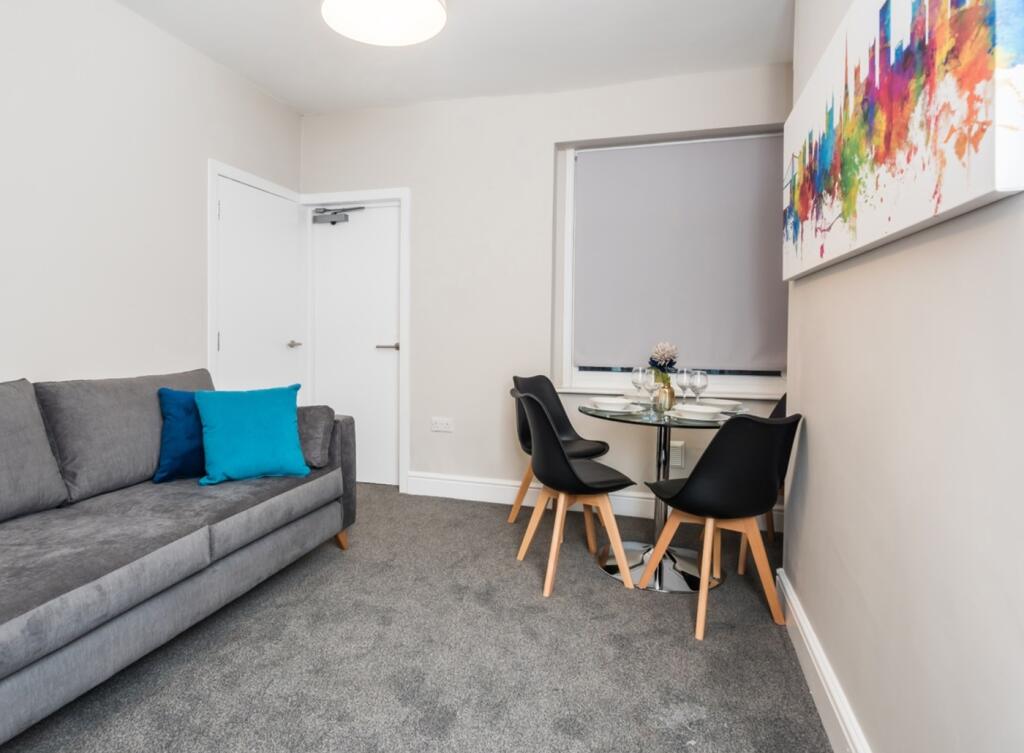 A stylish and inviting living room perfect for ...