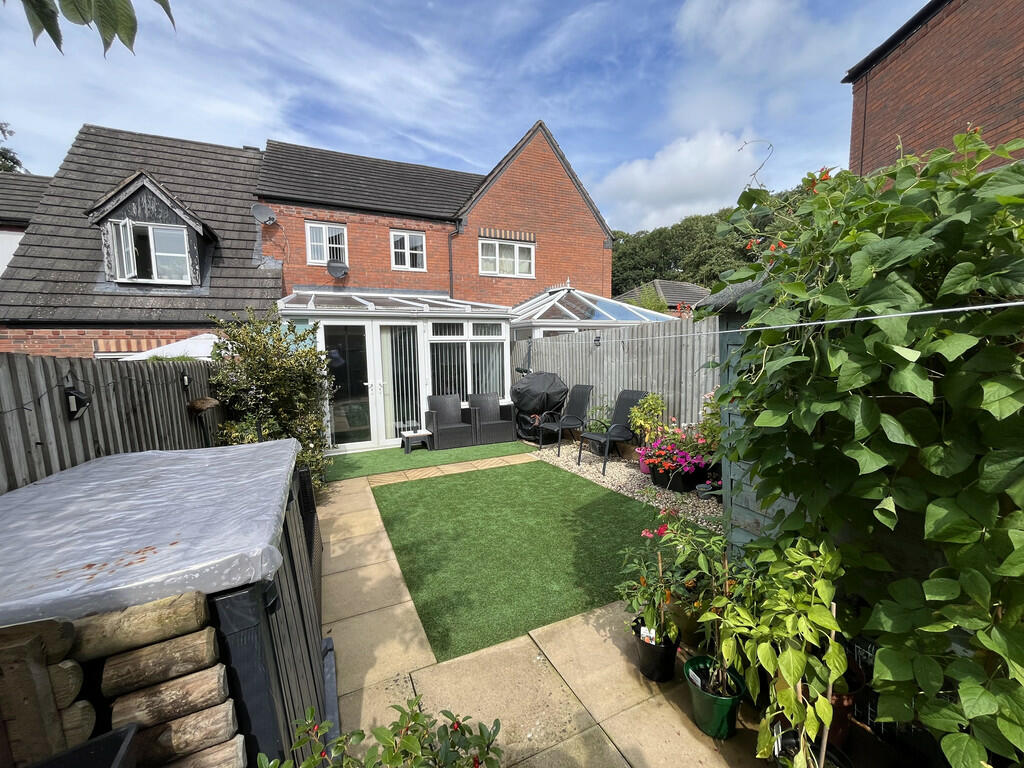 Rear garden to ex...