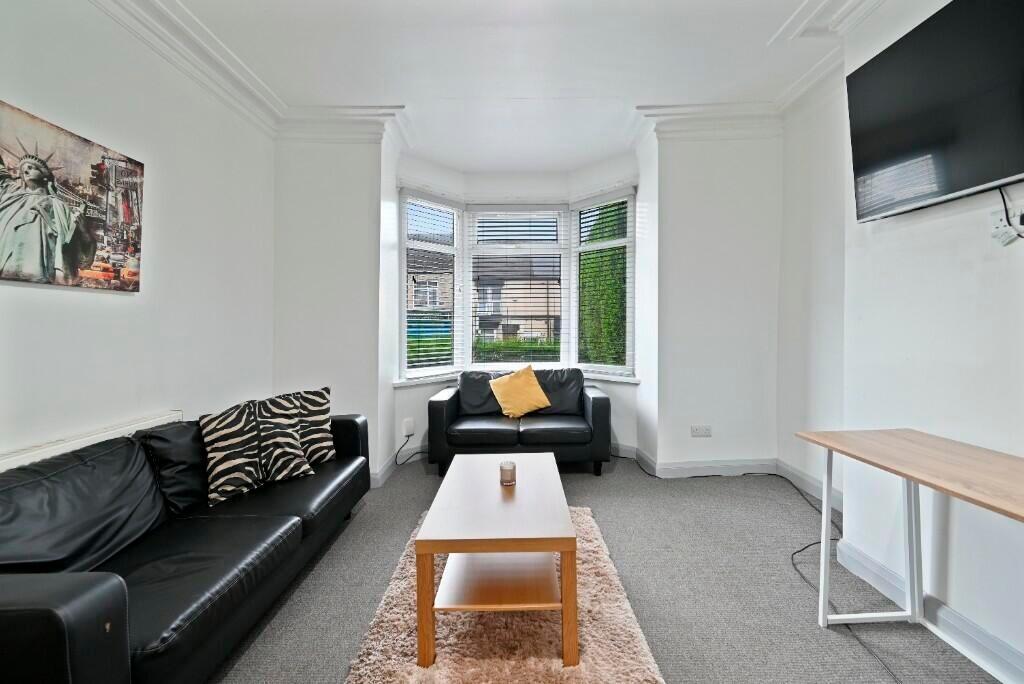 Bright and inviting living room featuring a lar...