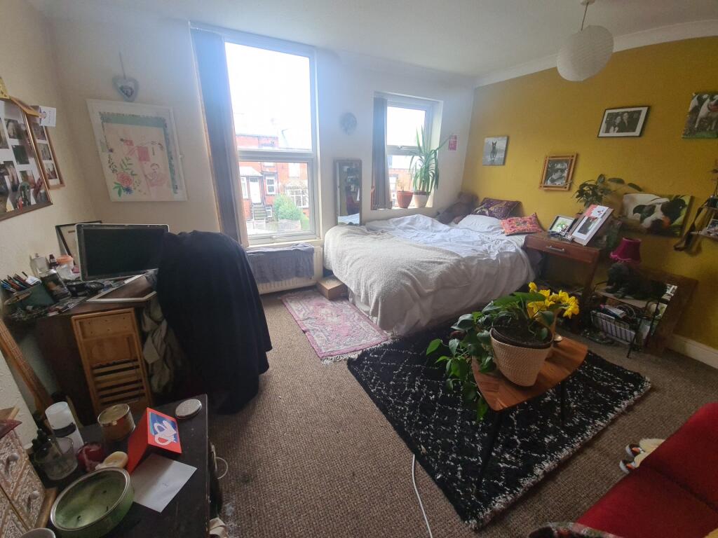 Bright and welcoming living room featuring larg...