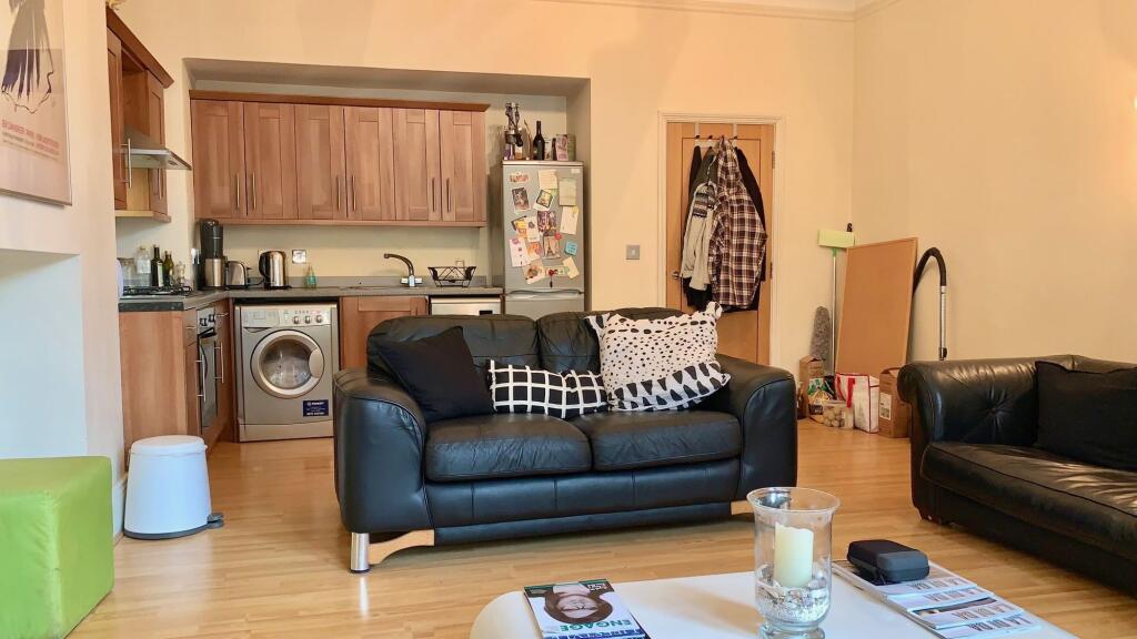 A cozy and functional living room featuring mod...