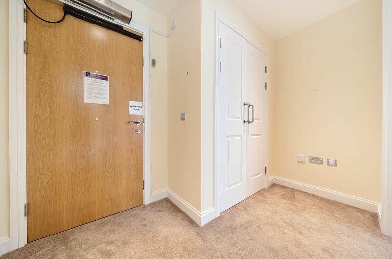 Hallway with storage cupboard