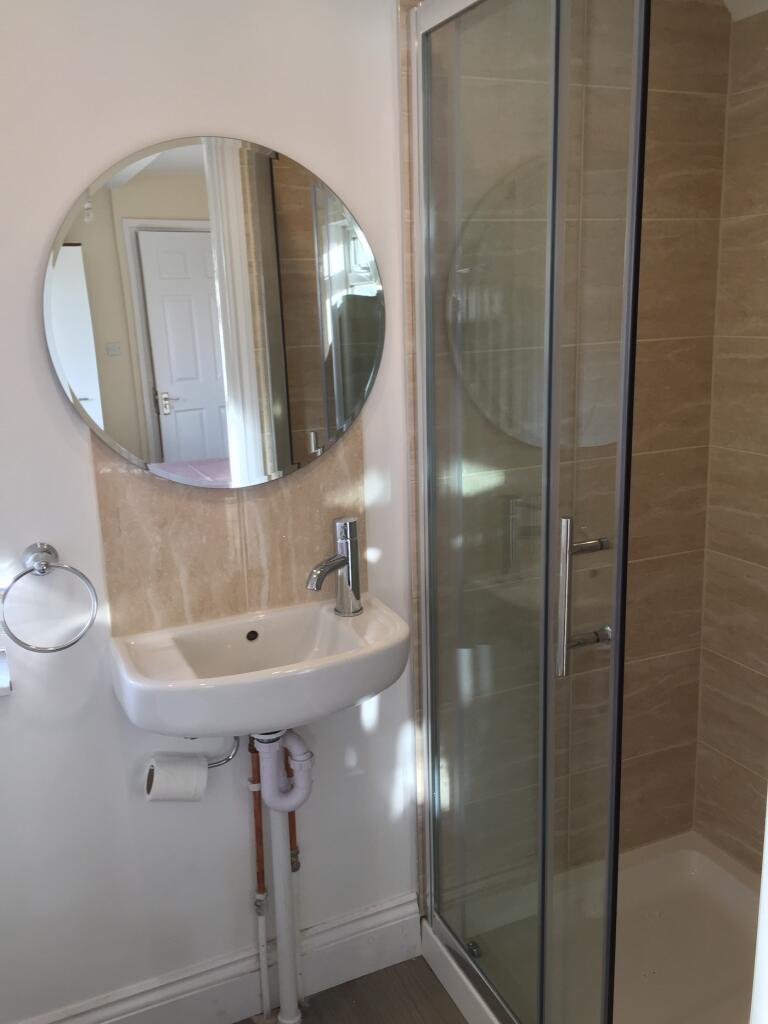 A modern bathroom featuring a sleek design with...