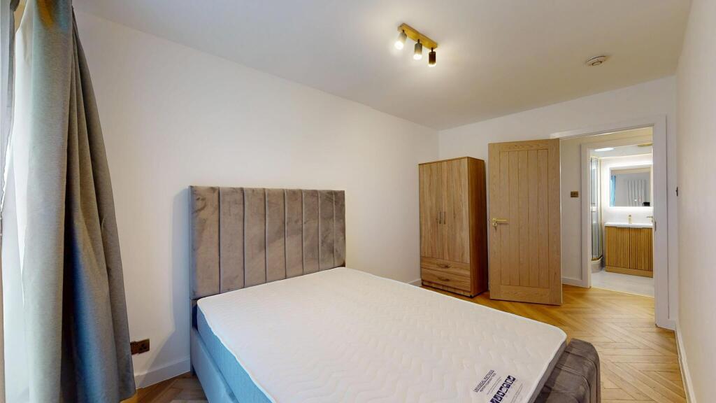 Bright and modern double bedroom featuring a pl...
